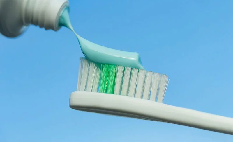 Toothpaste on a toothbrush.