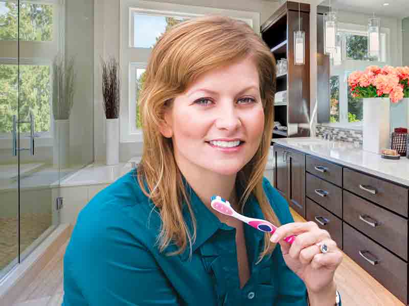 Woman brushing teeth in Washington MI